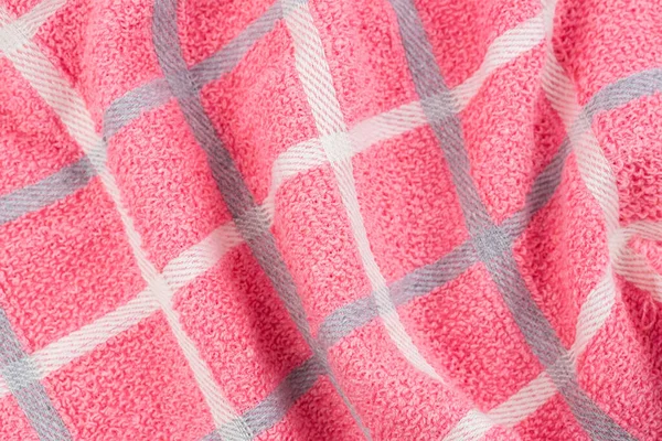 Pink, gray and white towel texture as a background.