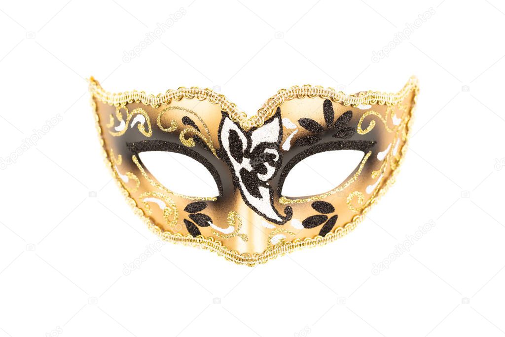 Carnival mask with black and golden ornament isolated on a white background.