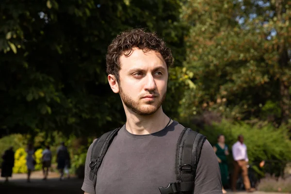 Handsome Bearded Man Curly Stylish Hair Standing Outdoors While Holding — Stock Photo, Image