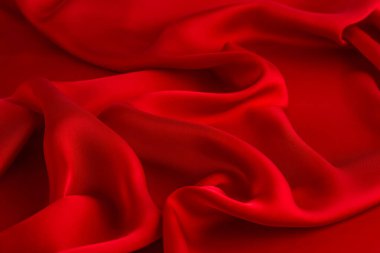 Arka plan olarak kırmızı ipek kumaş. Sevgililer Günü geçmişi.
