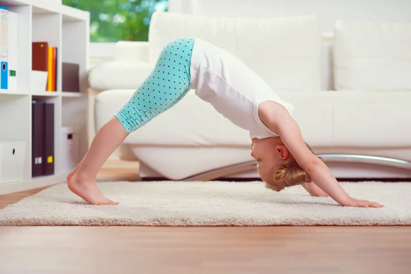 Cute little girl morning exercises — Stock Photo, Image