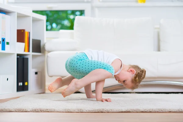 Cute little girl morning exercises — Stock Photo, Image