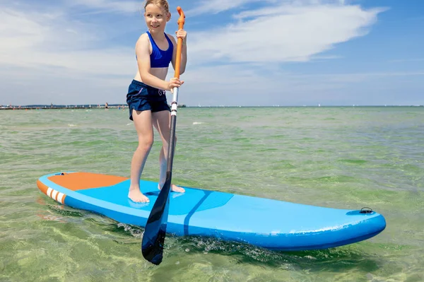 Cute Little Girl Ecercise Paddling Sup Board Sea Beautiful Sunny — Zdjęcie stockowe