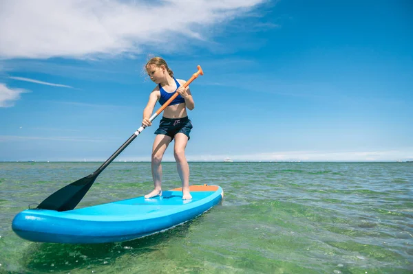 Cute Little Girl Ecercise Paddling Sup Board Sea Beautiful Sunny — Zdjęcie stockowe