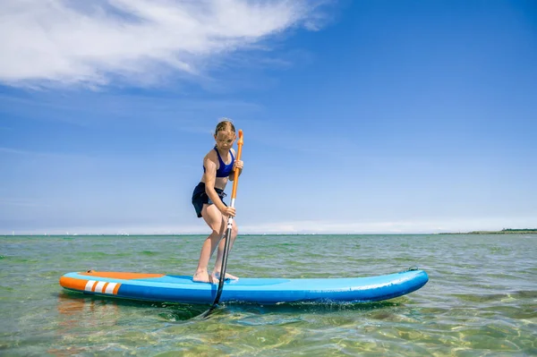Cute Little Girl Ecercise Paddling Sup Board Sea Beautiful Sunny — Zdjęcie stockowe