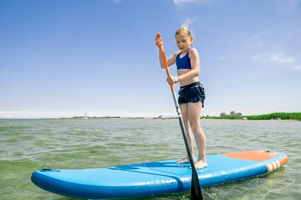 Cute Little Girl Ecercise Paddling Sup Board Sea Beautiful Sunny — Zdjęcie stockowe