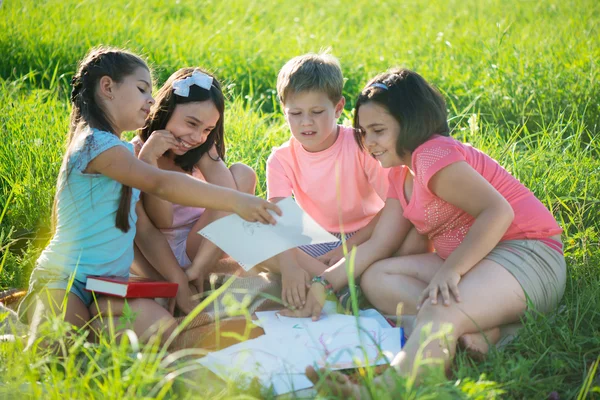 Group of children playing on grass Royalty Free Stock Photos