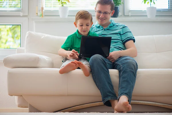 Happy father and child playing at home — Stok fotoğraf