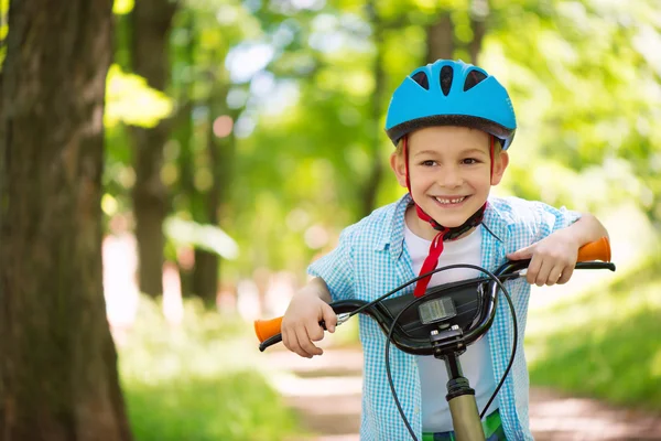 Cute little boy on bike — Stock Photo, Image