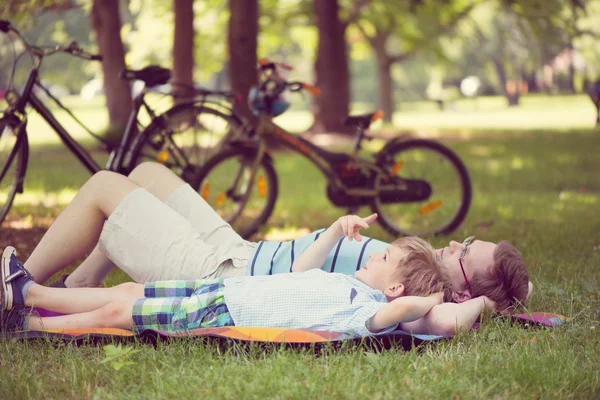 Father with little sun at park — Stock Photo, Image