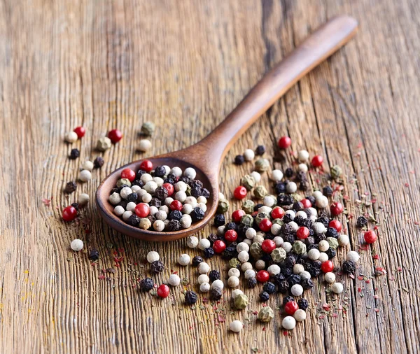 Pepper on a wooden background — Stock Photo, Image