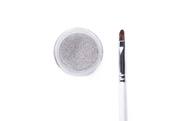 Silver glitter and make-up brush — Stock Photo, Image