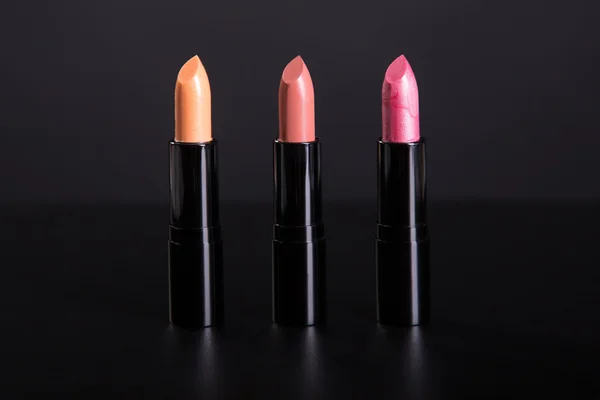 Row of trendy lipsticks in warm colors — Stock Photo, Image