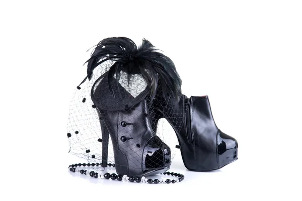 Elegant high heel shoes with bead necklace, and feather hair fascinator — Stock Photo, Image