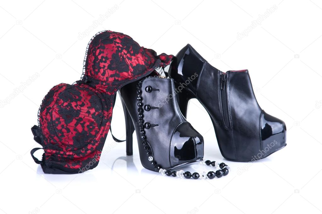 Black high heel female shoes, glamorous necklace and bra