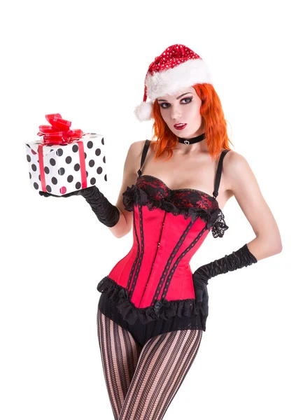 Girl in red corset and Santa Claus hat with gift box — Stock Photo, Image