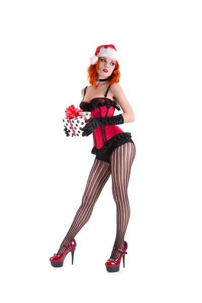 Ragazza in corsetto rosso e cappello di Babbo Natale — Foto Stock