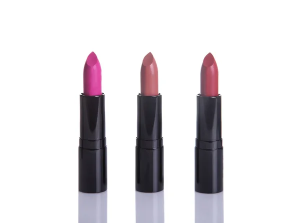 Three lipsticks in glamorous colors — Stock Photo, Image