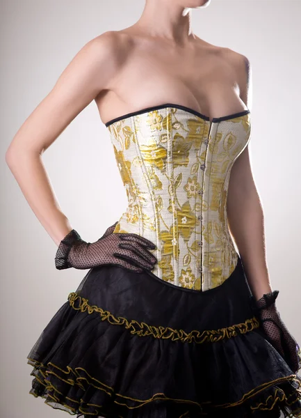Girl in corset with golden embroidery — Stock Photo, Image