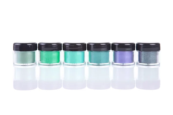 Eye shadows in clear plastic jars — Stock Photo, Image
