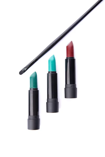 Top view of lipsticks and makeup brush — Stock Photo, Image