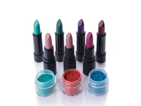 Set of bold lipsticks and eye shadows — Stock Photo, Image