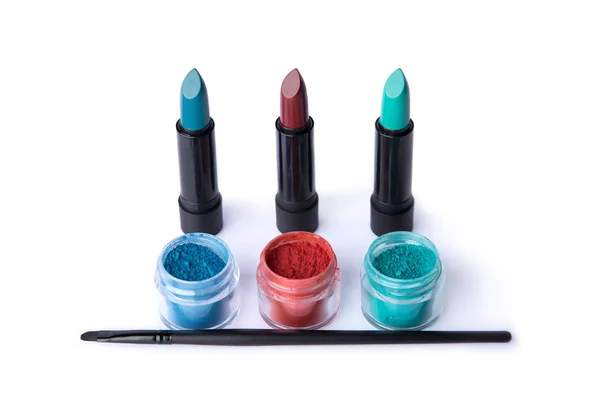 Makeup brush, lipsticks and eye shadows — Stock Photo, Image