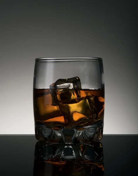 Whiskey glass with ice cubes — Stock Photo, Image