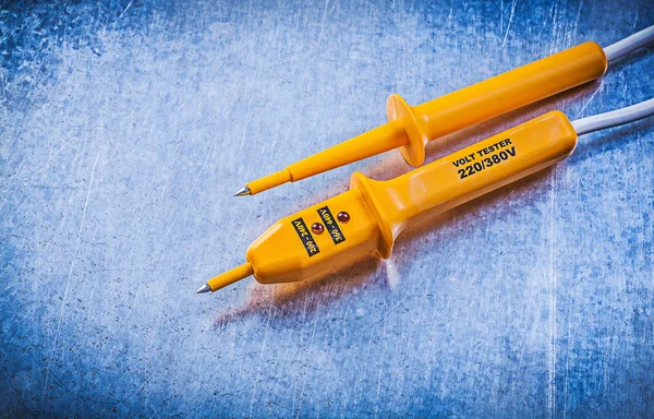 Electrical tester on scratched metallic — Stock Photo, Image