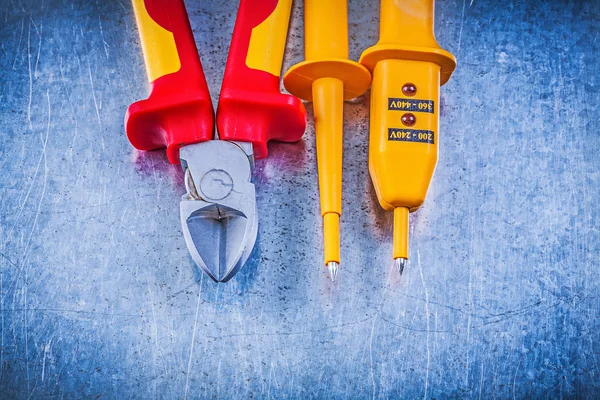 Yellow electrical tester, cutting pliers — Stock Photo, Image