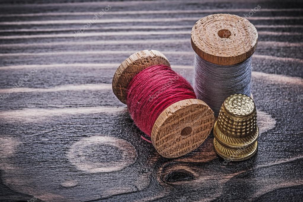 Vintage spools of thread thimbles — Stock Photo © mihalec 100713680