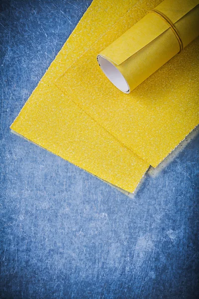 Yellow sandpapesr on metal — Stock Photo, Image