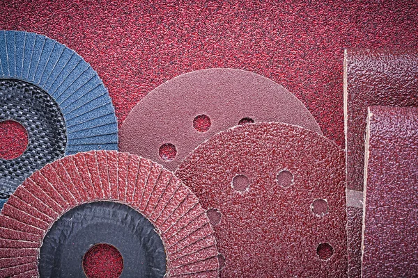 Rolled abrasive papers and grinding wheels — Stock Image Rolled abrasive papers and grinding wheels Stock Photo