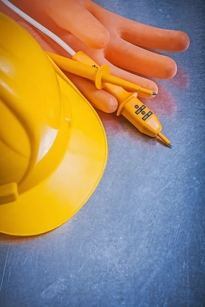 Rubber gloves, hard hat and tester — Stock Photo, Image