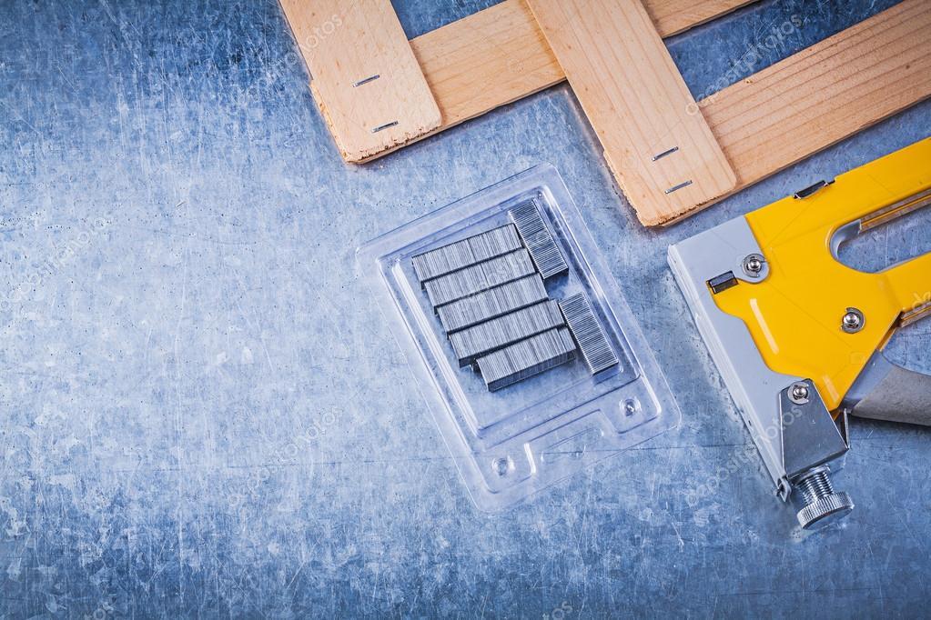 Construction stapler, metal staples and planks — Stock Photo © mihalec