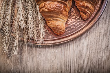 Golden wheat rye ears and croissants clipart