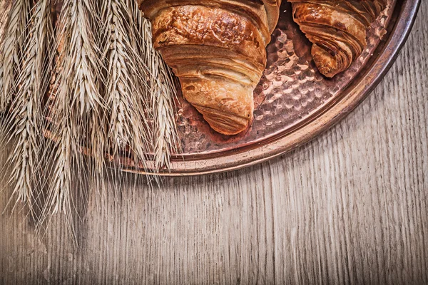 Golden wheat rye ears and croissants — Stock Photo, Image