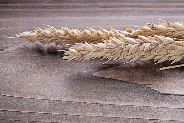 Ears of wheat on board — Stock Photo, Image