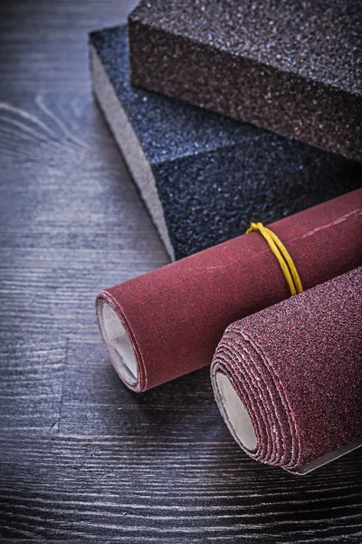 Rolled emery papers and sanding sponges — Stock Image Rolled emery papers and sanding sponges Royalty Free Stock Photos