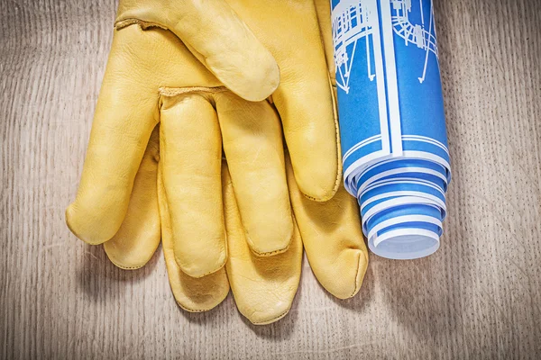 Leather safety gloves and construction plans — Stock Photo, Image