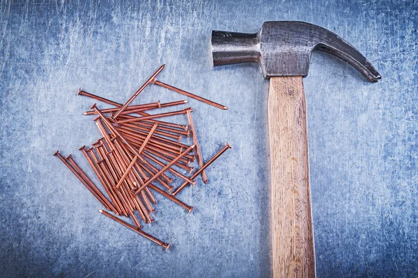 Vintage claw hammer and construction nails — Stock Photo, Image