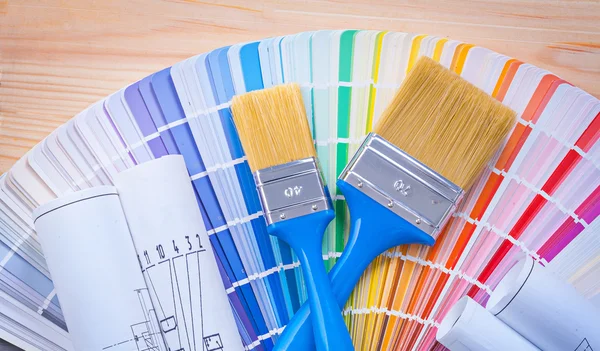 Paintbrushes on color palette — Stock Photo, Image