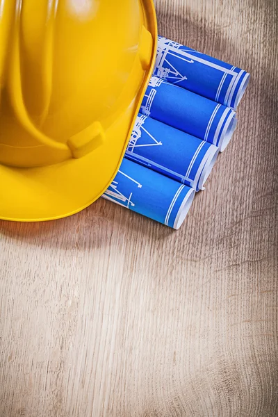 Blue engineering drawings and hard hat — Stock Photo, Image