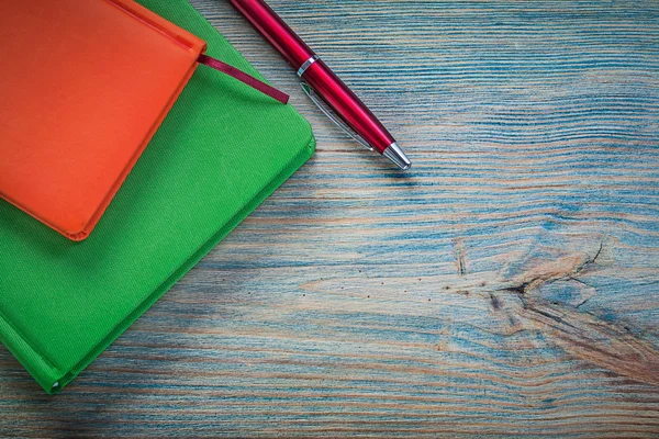 Closed note books and ballpoint pen — Stock Photo, Image