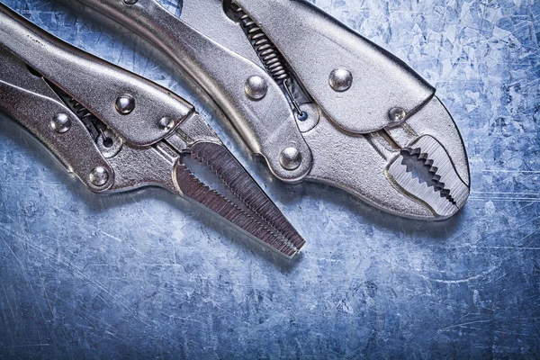 Lock jaw pliers on metallic background construction concept — Stock Photo, Image