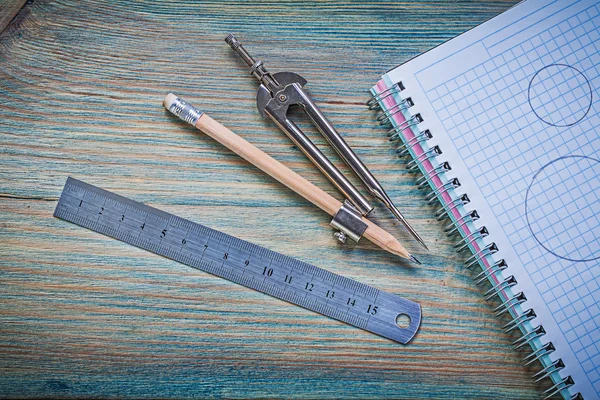 Set of checked copybook ruler pair of compasses pencil on vintag — Stock Photo, Image