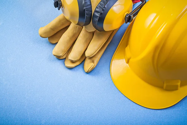 Earmuffs safety gloves building helmet — Stock Photo, Image