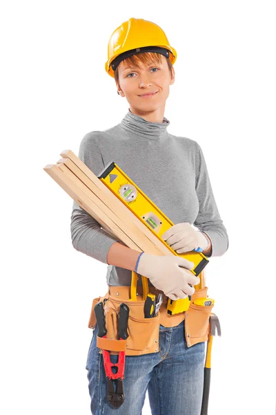 Mujer trabajadora sosteniendo tablones — Foto de Stock