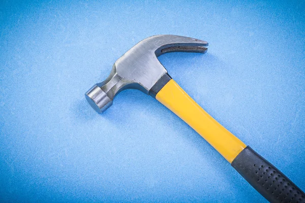 Claw hammer on blue background — Stock Photo, Image