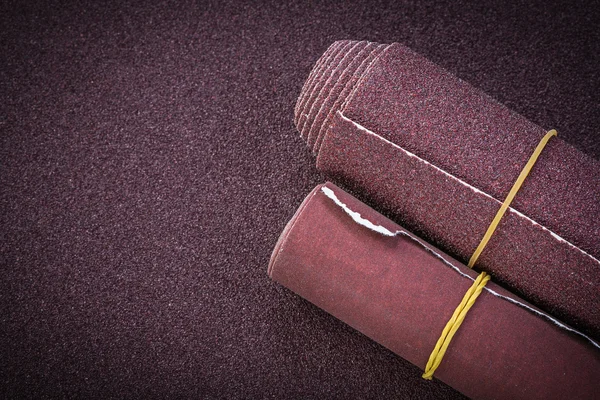 Sandpaper rolls on polishing sheet — Stock Photo, Image